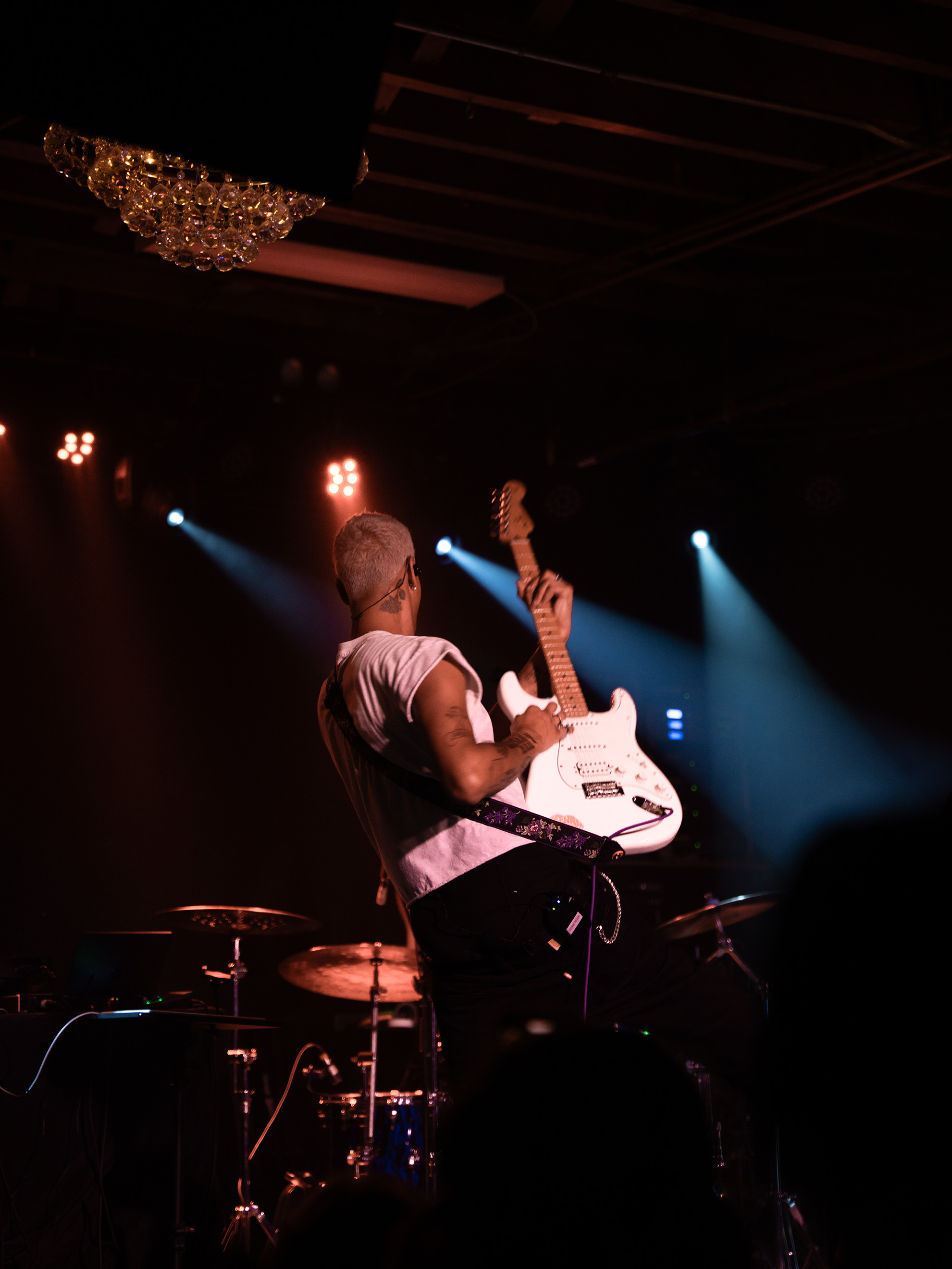 Keenan Trevon's back while playing guitar