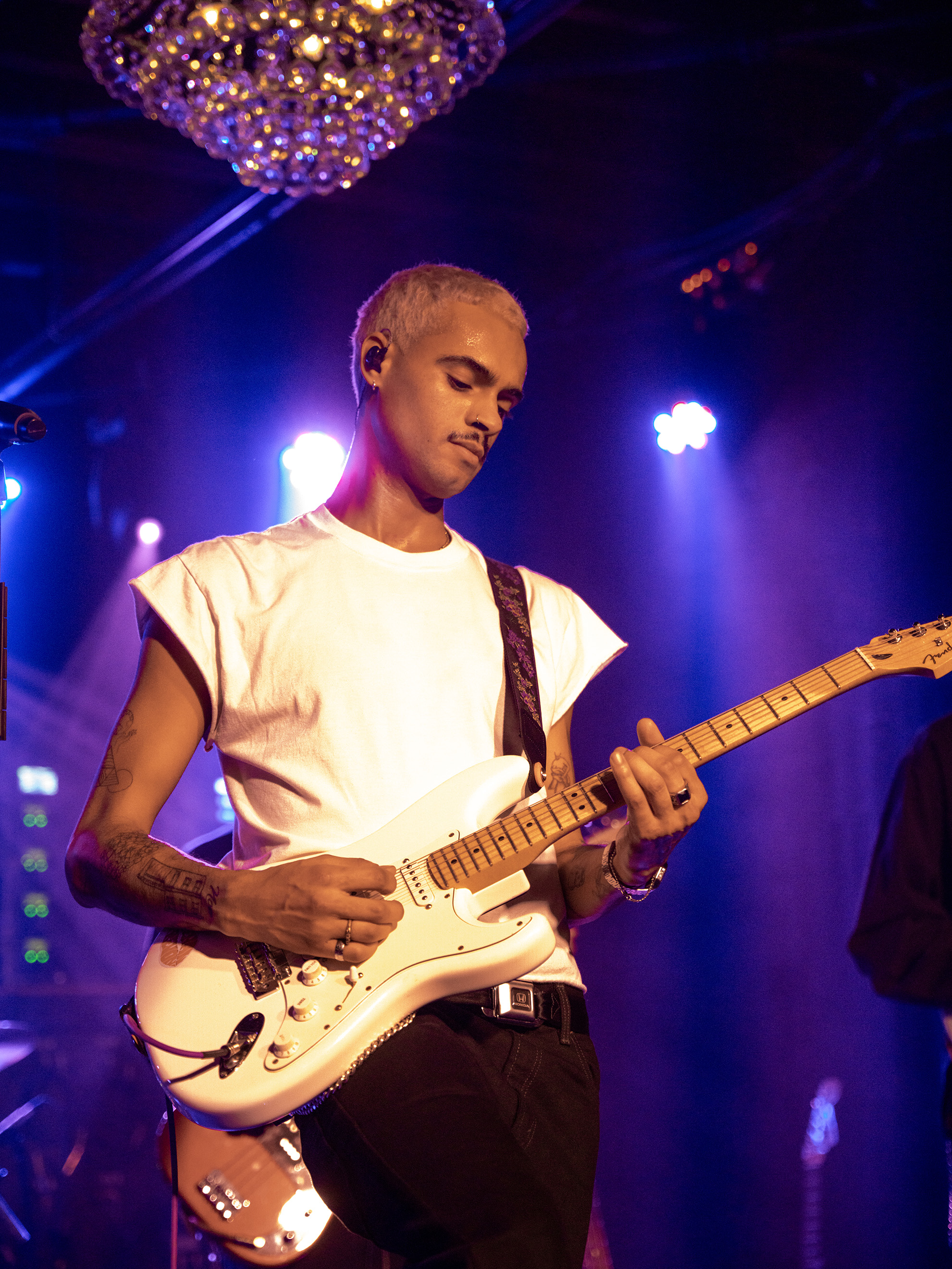 Keenan Trevon playing guitar and eyes are closed