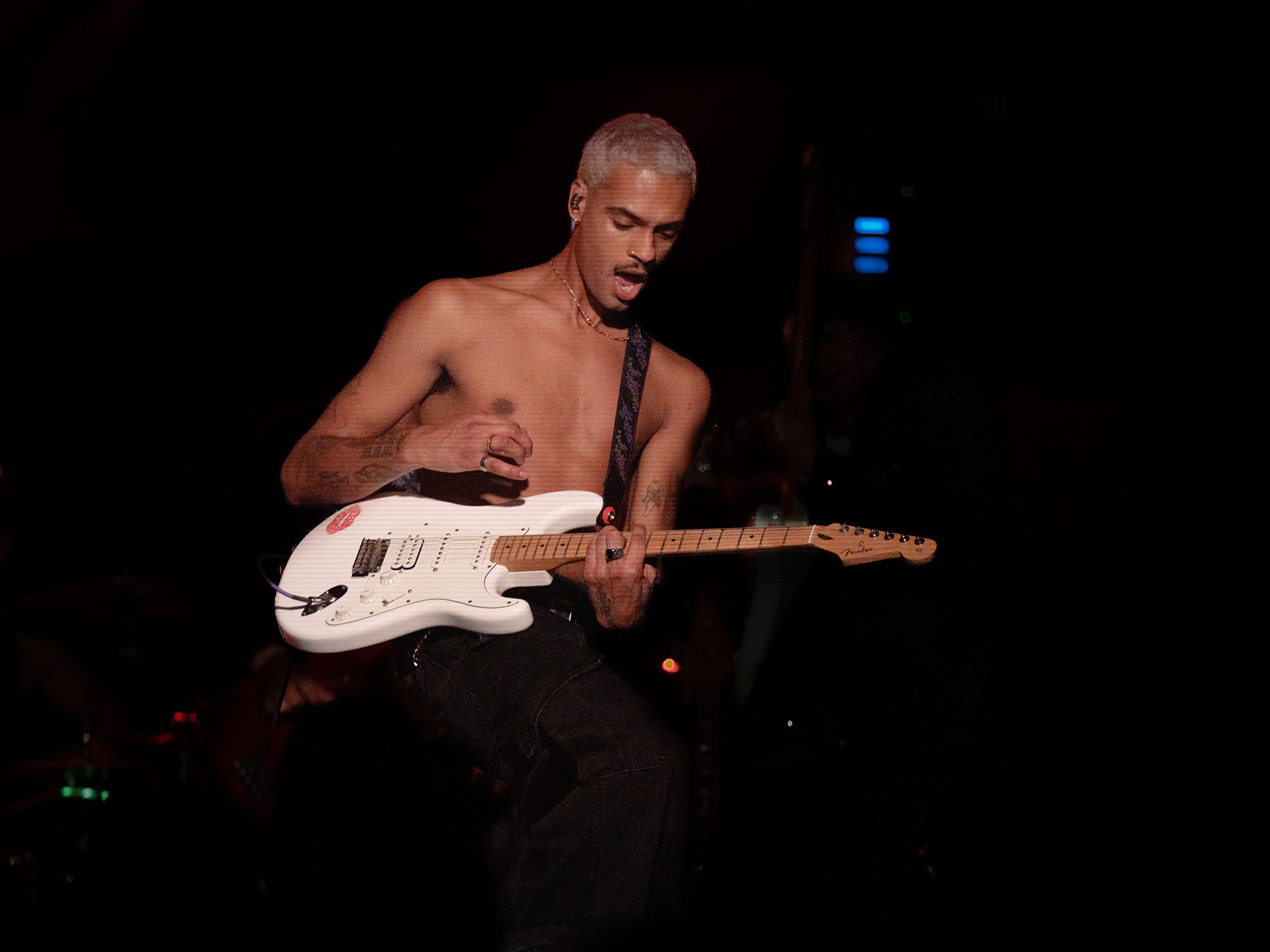 Keenan Trevon playing guitar enthusiastically